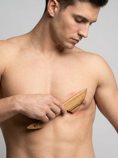Handcrafted wooden BDSM scraper made from whisky barrel oak, featuring double-ended design for kink and wax play.