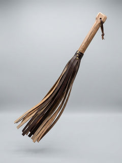 Heavyweight BDSM flogger from Barrel of Pain, crafted with whisky barrel oak and repurposed leather for kink play.