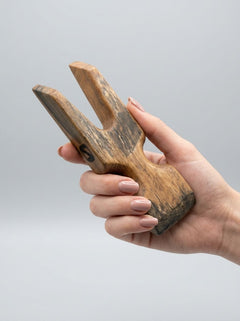 Barrel of Pain Fang scratcher BDSM accessory with metal claws and leather strap for sensory stimulation and playful restraint.