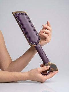 Barrel of Pain padded paddle with ergonomic handle, black and red design, used for impact play and sensation play.
