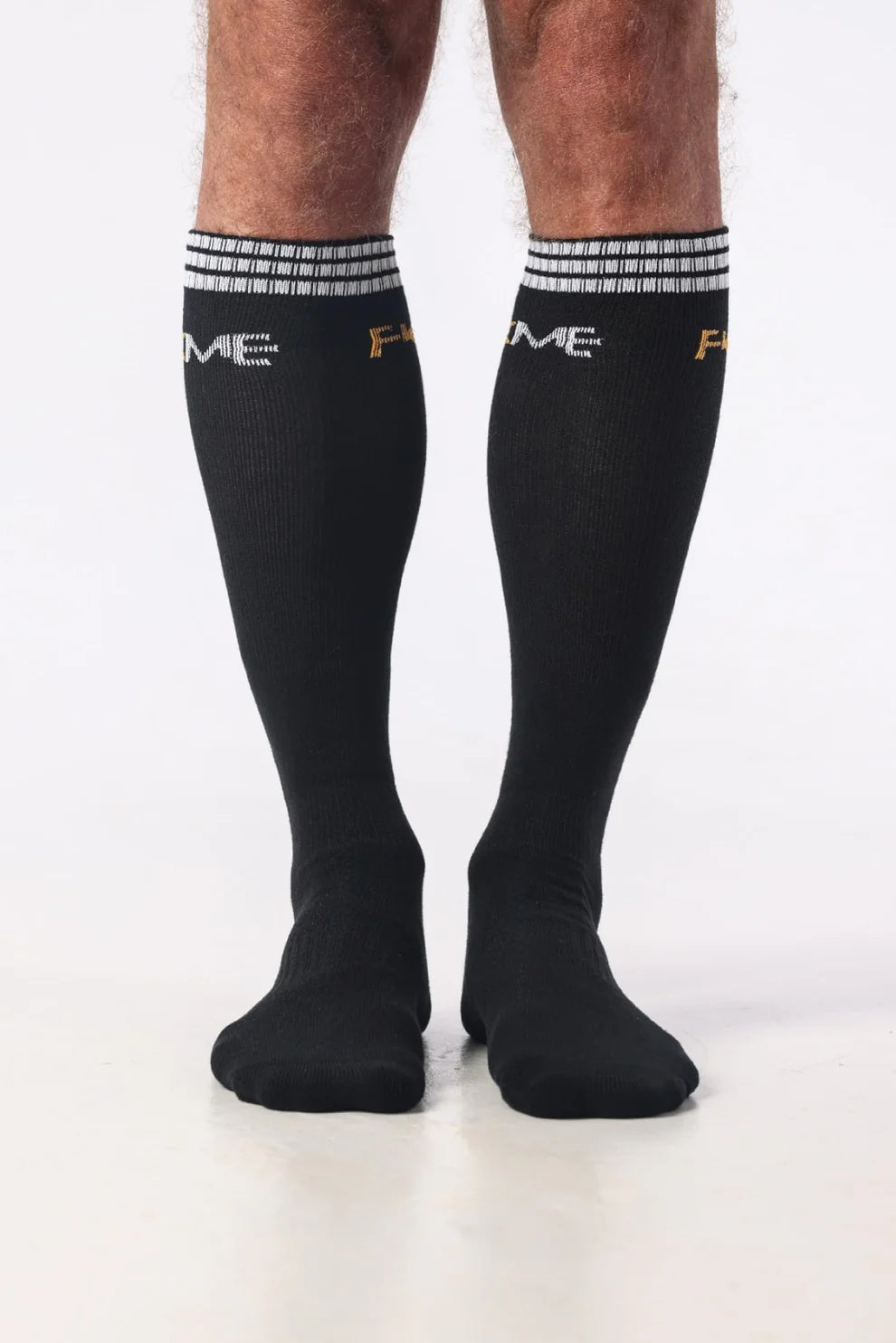 FKME knee-high socks in vibrant colors, stretchy fabric, and comfortable fit, perfect for casual or fashion-forward wear.