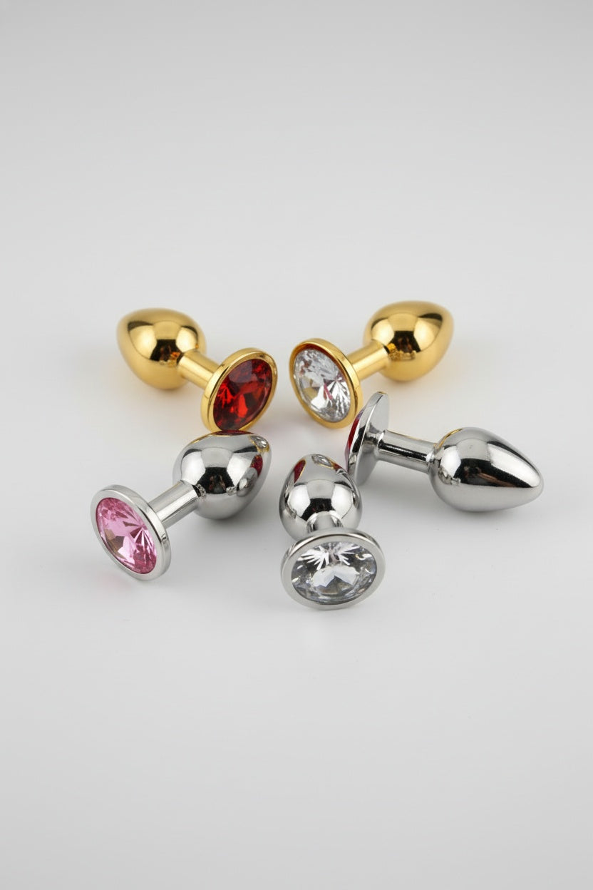 Toosh butt plug with jeweled base, made of aluminium alloy, designed for safe use by beginners and experienced users.