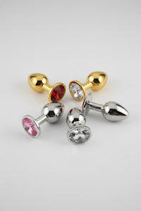 Toosh Butt Plug With Gems displayed elegantly, showcasing its luxurious aluminium alloy body and jewelled base.