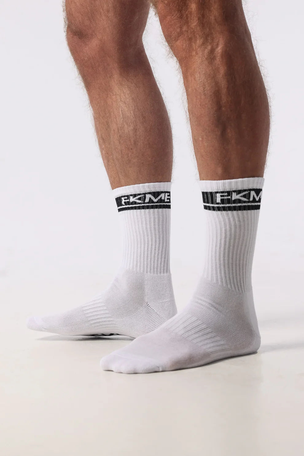 FKME Logo Socks featuring a black background and white FKME logo, casual crew-length sock for everyday wear.
