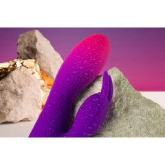 Rocks Off Glo-Girl rabbit vibrator with dual motors, flexible waterproof silicone, 10 vibration modes, shown in a sleek design.