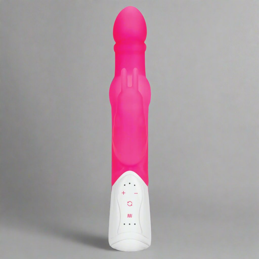 a pink and white rabbit vibrator on a gray background