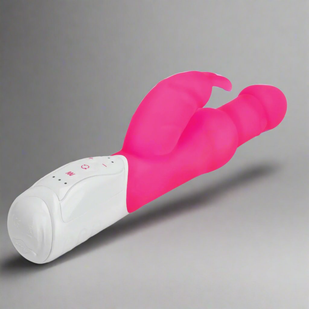 a pink and white rabbit vibrator on a gray background