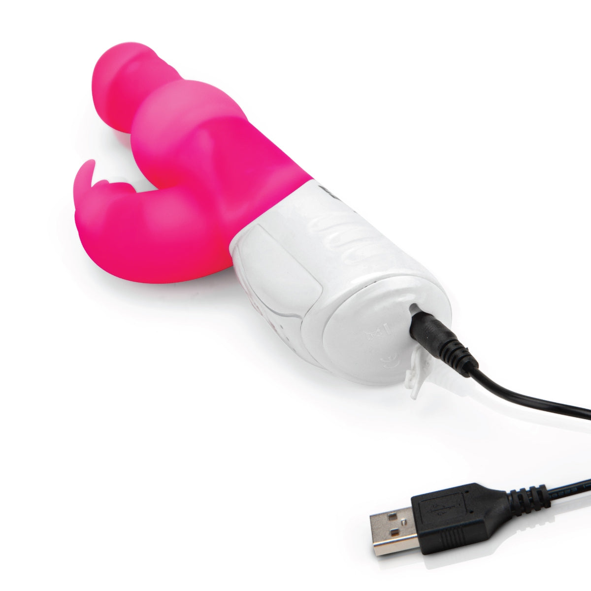 a pink and white rabbit vibrator connected to a black usb charger on a white background