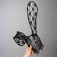 Thumbnail for a hand holding a black lace bunny ears headband