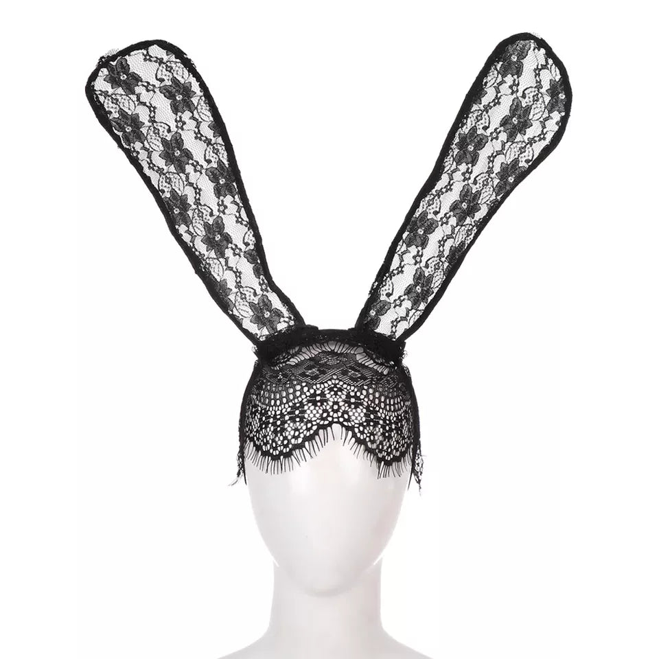 a white mannequin head with a black lace bunny ears headband with veil