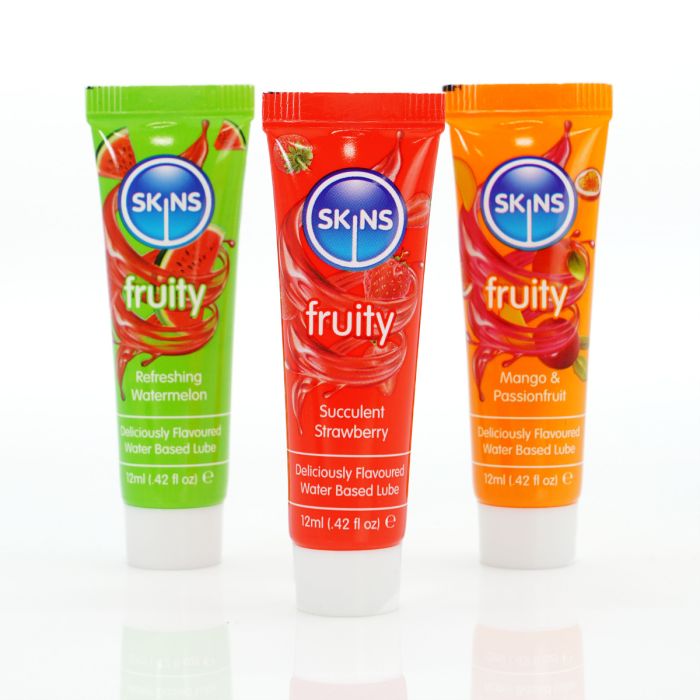 three tubes of fruity toothpaste sitting next to each other