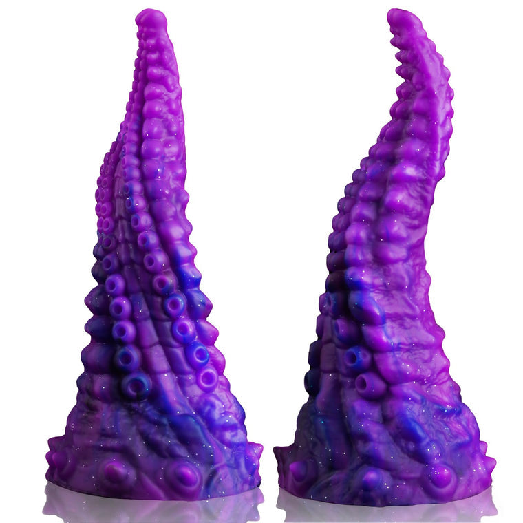 a couple of purple candles sitting next to each other