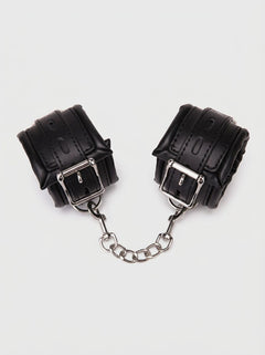 Me You Us Wrist Cuffs – Black/Silver, premium one-size wrist cuffs for stylish bedroom bondage