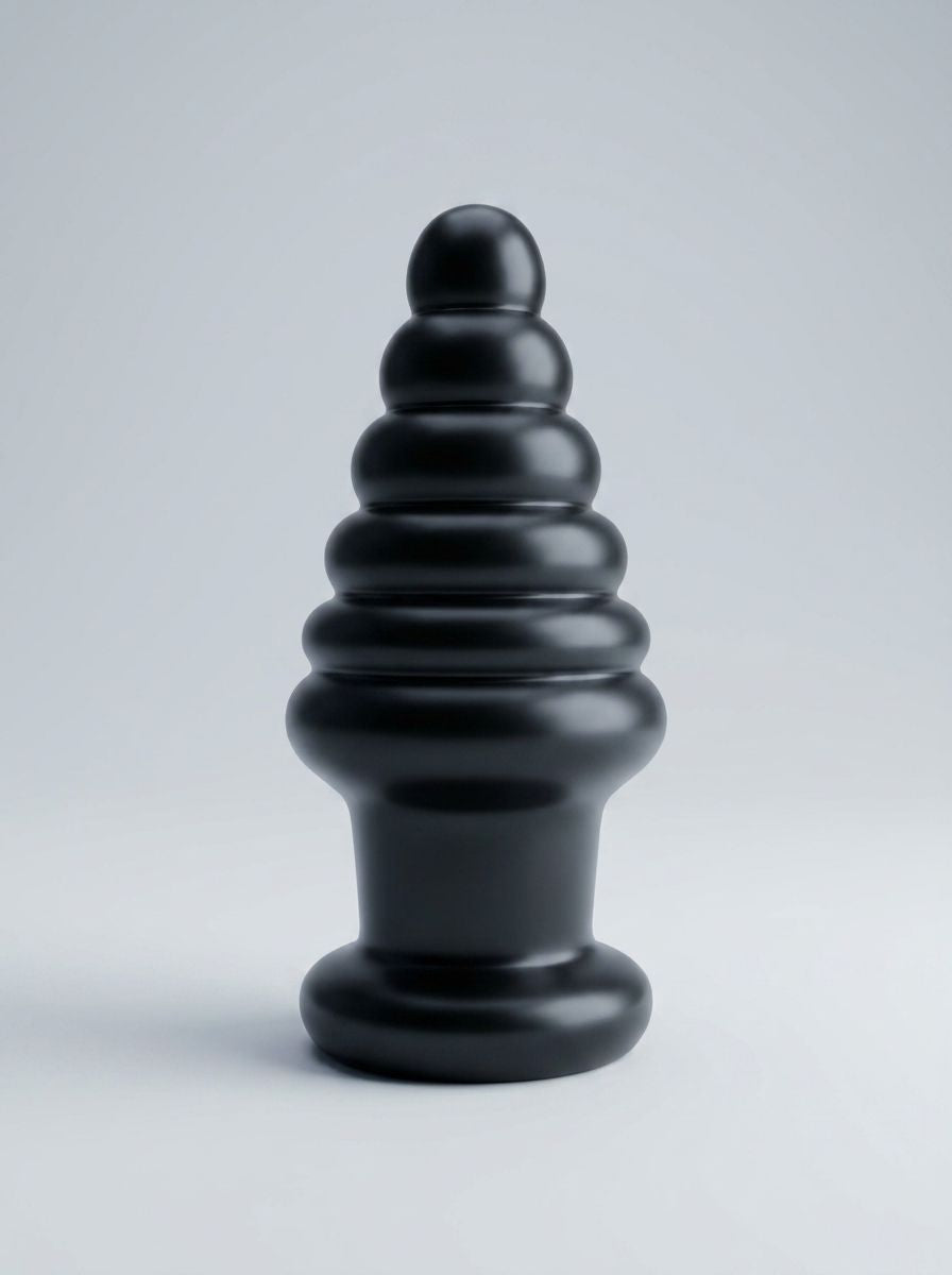 Prowler RED Twisted Tease Large Butt Plug Black, a luxurious and advanced anal plug designed for experienced users, featuring a unique 6-ring tapered shape for progressive stimulation and substantial fullness.