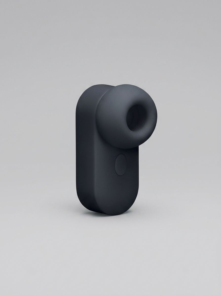 Me You Us Signature The Travel Tapper Pulsating Clitoral Suction Vibrator close-up, rechargeable clitoral suction vibrator with smooth silicone finish