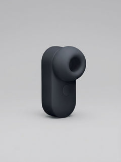 Me You Us Signature The Travel Tapper Pulsating Clitoral Suction Vibrator close-up, rechargeable clitoral suction vibrator with smooth silicone finish