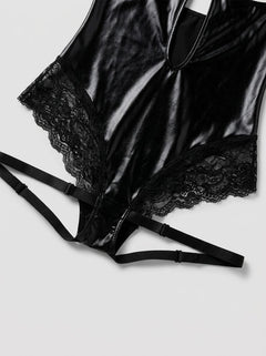 Model wearing the Rene Rofe Vinyl Vibes Strappy Open Cup Wet Look Lace Teddy, embodying confidence and allure, perfect for boudoir styling or gifting.