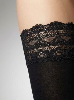 Stylish model wearing Ladies 80 Denier Opaque Black Lace-Top Sexy Hold Ups, demonstrating the perfect blend of elegance and functionality in women's hosiery.