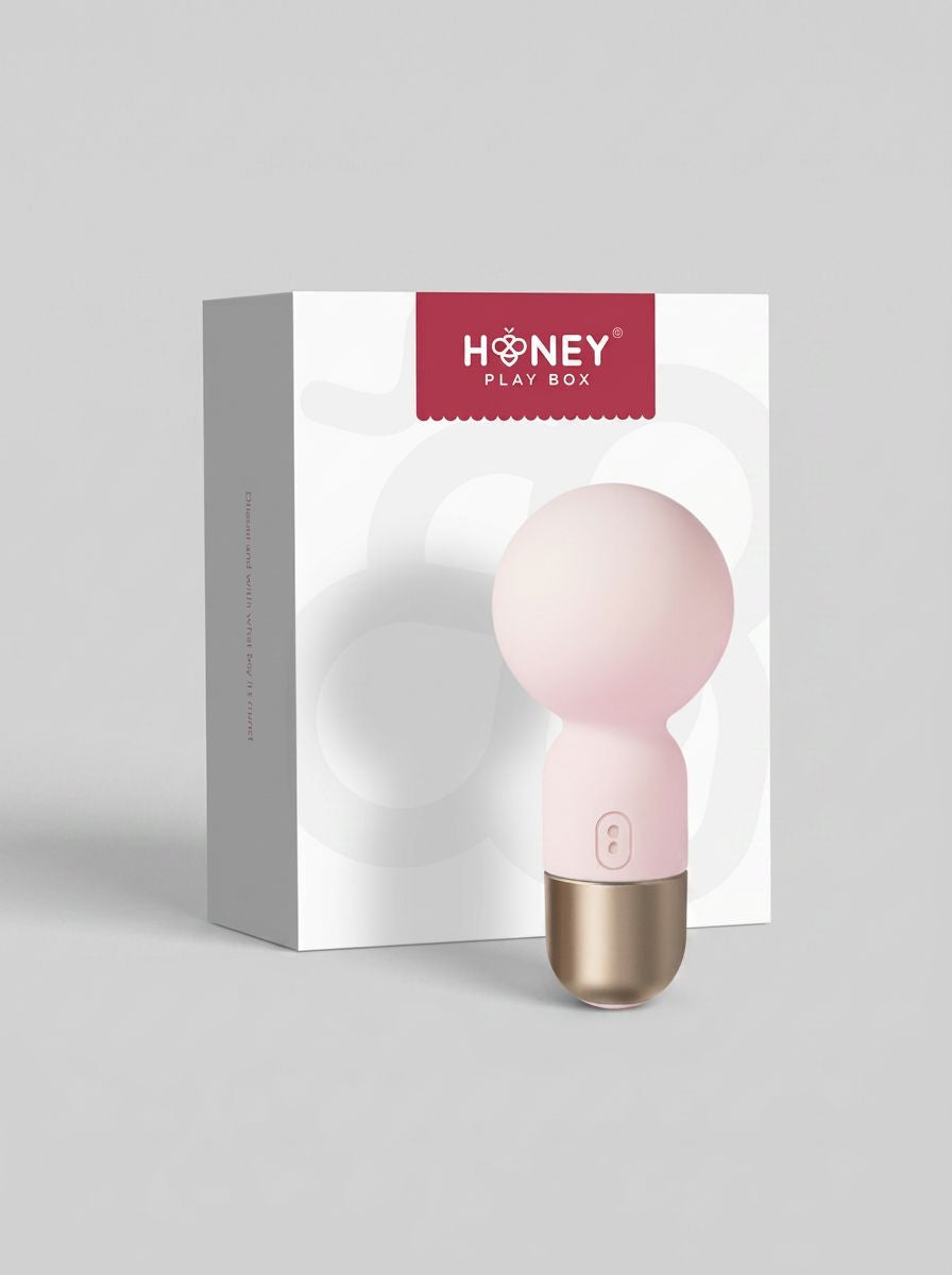Pokewan Pocket Mini Vibrating Wand Massager displayed beside its elegant Honeyplaybox packaging in pale pink