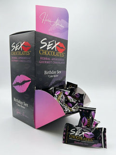 Two pieces of Sweet Treats Sex Chocolate gourmet aphrodisiac in a clear wrapper, showcasing smooth, rich chocolate for romantic indulgence.
