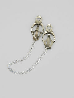 Close-up of Bound to Please Clover Nipple Clamps featuring a shiny metal finish and rubber grips, ideal for enhancing pleasure in BDSM and fetish play.