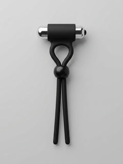 Close-up view of the Rev-Rings Vibrating Adjustable Cock Ring, highlighting the luxurious silicone material and the sophisticated design of this adjustable cock ring for optimal stimulation.