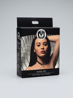 A flat lay of the Posh Pet Gold O-Ring Slim Beginners Bondage Choker, capturing its exquisite craftsmanship and appealing aesthetic for luxury bondage enthusiasts.