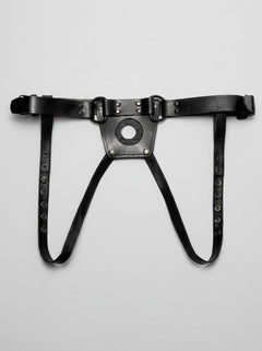Detailed view of the Prowler RED Leather Dong Jock Strap Unisex Strap-On Harness, with a focus on the front pouch opening designed for strap harness versatility.