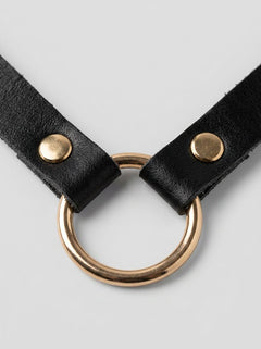 Stylish model wearing the Posh Pet Gold O-Ring Slim Beginners Bondage Choker, embodying a luxurious and sophisticated BDSM accessory for pets.