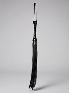 Close-up of the Prowler RED Hard Whip - 34 Inch Leather BDSM Impact Flogger demonstrating the strong, yet elegant leather material, perfect for intense sensations in impact play.