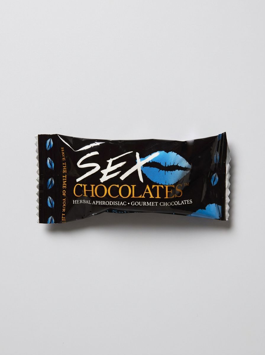 Sweet Treats Sex Chocolate two 10g gourmet aphrodisiac chocolates, close-up of the indulgent, textured chocolate pieces.