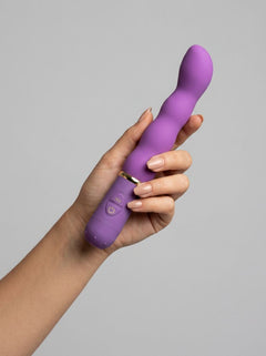 Close up of Me You Us Bliss G-Spot Vibrator Purple, emphasizing the rippled shaft feature for enhanced sensation during use.
