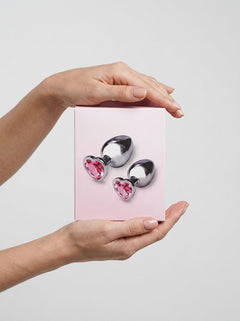 b-Vibe Jewel Metal Training Set featuring luxurious heart-shaped pink gem base and sleek metal design for enhanced intimate moments.