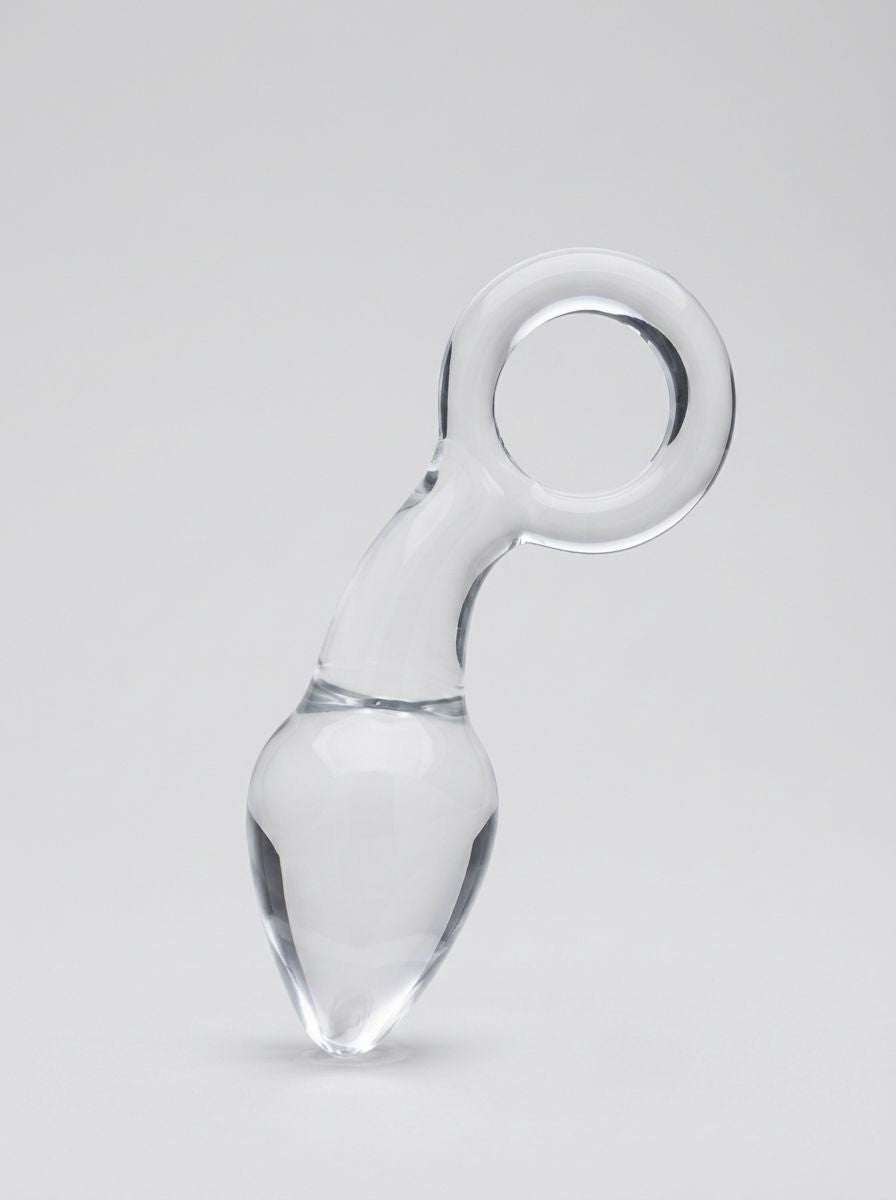 Clarity Utopian Delight 3.5 Inch Glass Butt Plug displayed upright, showcasing the clear glass body, tapered tip and circular handle