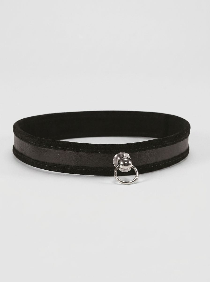 S&M Black Day Collar with O-Ring, a luxurious black collar designed for everyday wear, featuring a polished metal O-ring for charms.