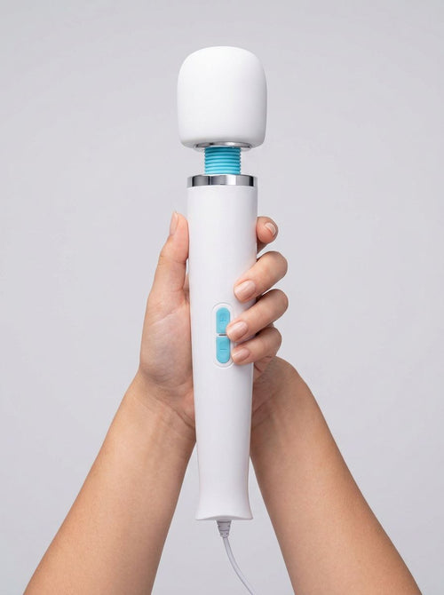 Elegant Le Wand Classique Plug-In Wand Massager showcasing its sleek design and soft silicone head, ideal for luxurious relaxation and deep muscle relief.
