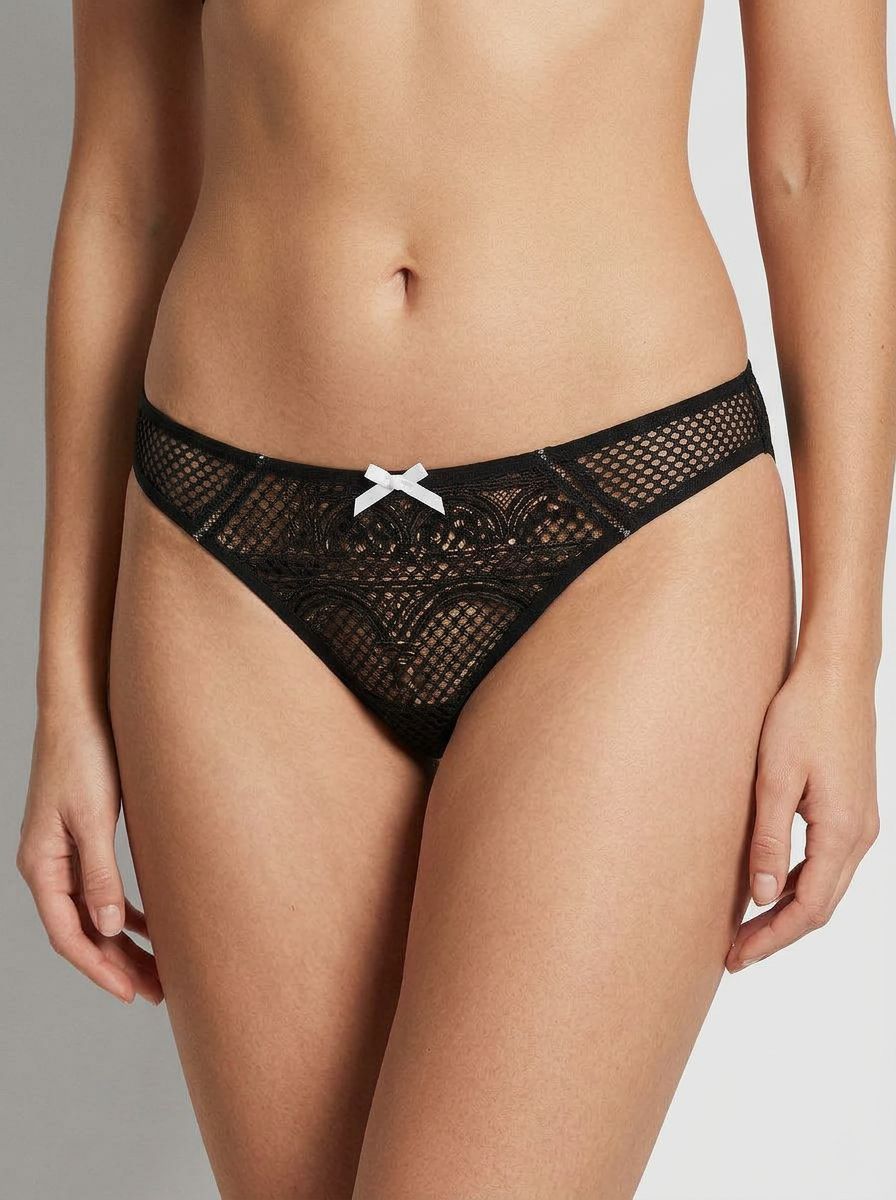 Baci black lace mesh crotchless panty with seductive floral appliqué, made of nylon and spandex, displayed on a model.