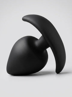 Artistic arrangement of Scandals Thick Anal Training Anchor Butt Plugs, highlighting their luxurious silicone finish and comfort for long-term wear with anal training plugs.