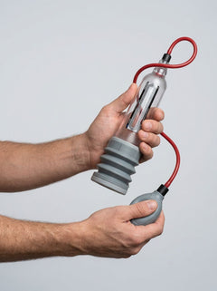 Clear Bathmate Hydroxtreme 9 penis pump for enlarging, with transparent cylindrical chamber and easy-to-use design.
