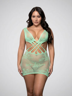 Curvaceous model wearing the Fantasy Lingerie Yours Truly Seaglass Green Floral Knit Strappy Crossover Dress, displaying a flattering silhouette and the enchanting hues of the green strappy dress.