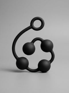 Artistic view of Prowler RED Silicone Anal Beads forming a stylish shape, illustrating their sophistication and functionality.