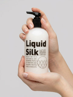 Liquid Silk water-based personal lubricant in a clear bottle, showcasing smooth, silky texture for intimate use.