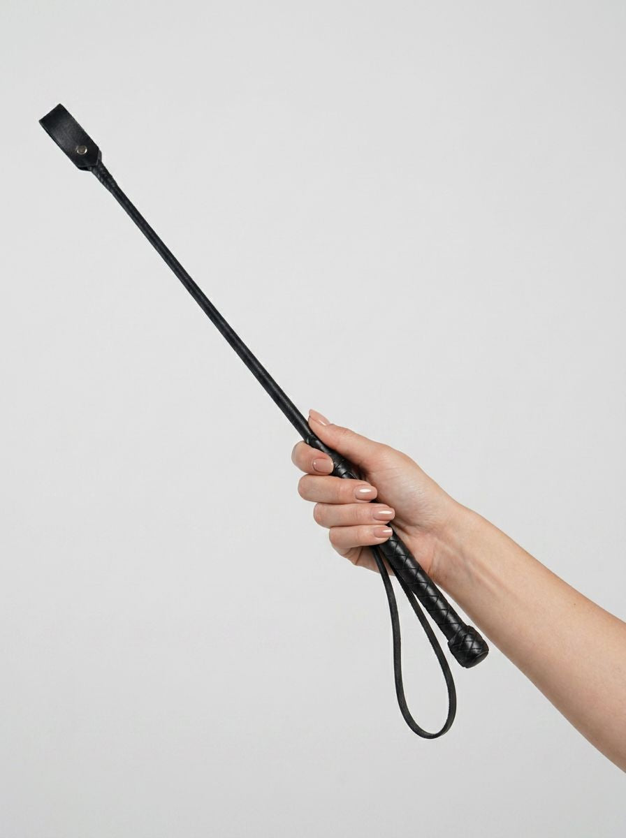 Bound Noir Nubuck leather BDSM riding crop with a sleek handle and slender shaft, designed for impact play.