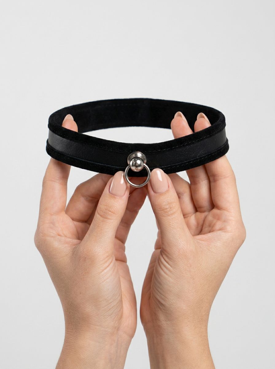 Black BDSM collar with O-ring from Sex & Mischief, slim design, made for bondage and playful restraint.