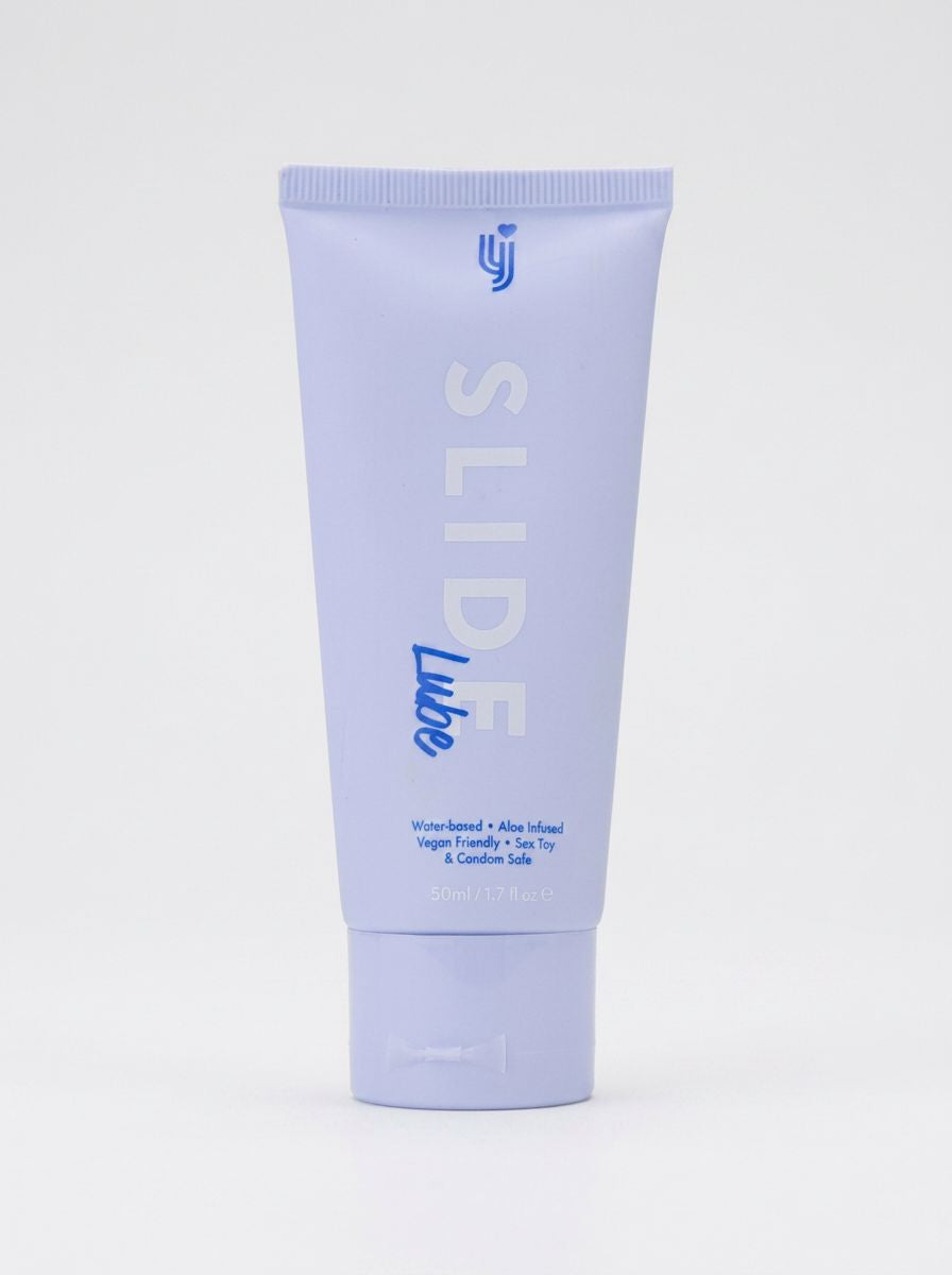 Loving Joy Slide Water-Based Lubricant on soft fabric illustrating its non-greasy, ultra-smooth texture for intimate indulgence.