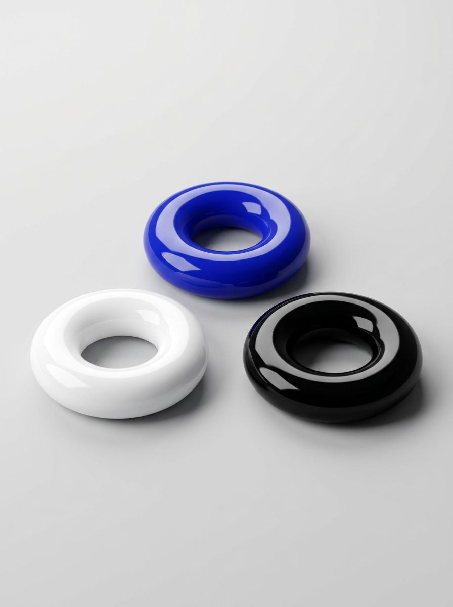 JoyRings Doughnut Stretchy Cock Rings (3 Pack) arranged in three colours, showing the rounded doughnut shape of these luxury cock rings.