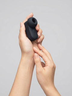 Me You Us Signature The Travel Tapper Pulsating Clitoral Suction Vibrator in black, compact clitoral suction vibrator product view
