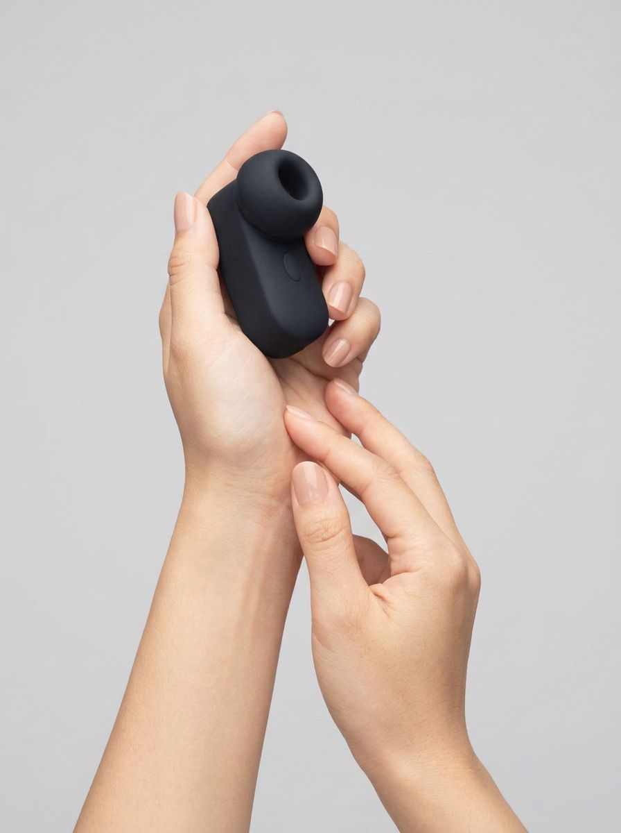 Me You Us Signature The Travel Tapper Pulsating Clitoral Suction Vibrator in black, compact clitoral suction vibrator product view