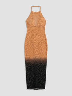 Captivating Dreamgirl Black/Copper Ombre Maxi Seamless Zebra Knit Dress displayed in a lavish setting, embodying chic allure and a flexible fit that enhances your natural shape, a standout choice for a maxi zebra dress.