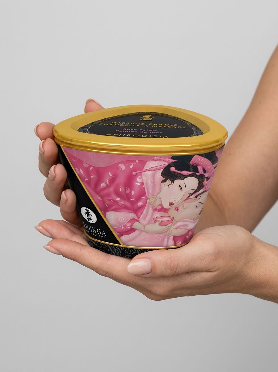 Shunga Sensual Soy Wax Erotic Massage Oil Candle 170ml massage candle with lid held in both hands